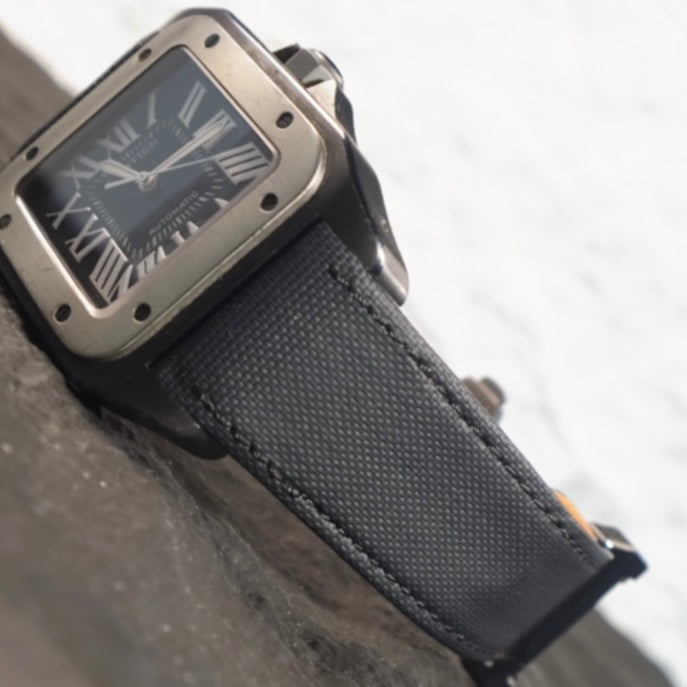 Black canvas leather strap on Cartier santos 100 watch 