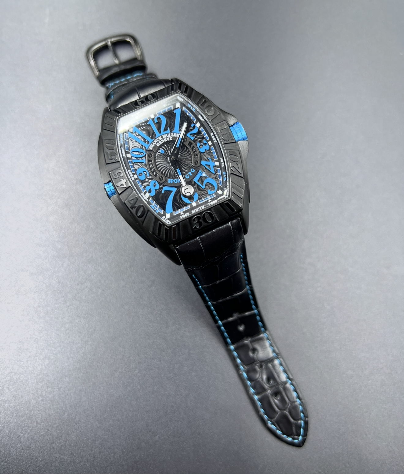 Watchstrapco black alligator strap with light blue stitching on the Franck muller 9900 watch. With matching light blue on the dial 