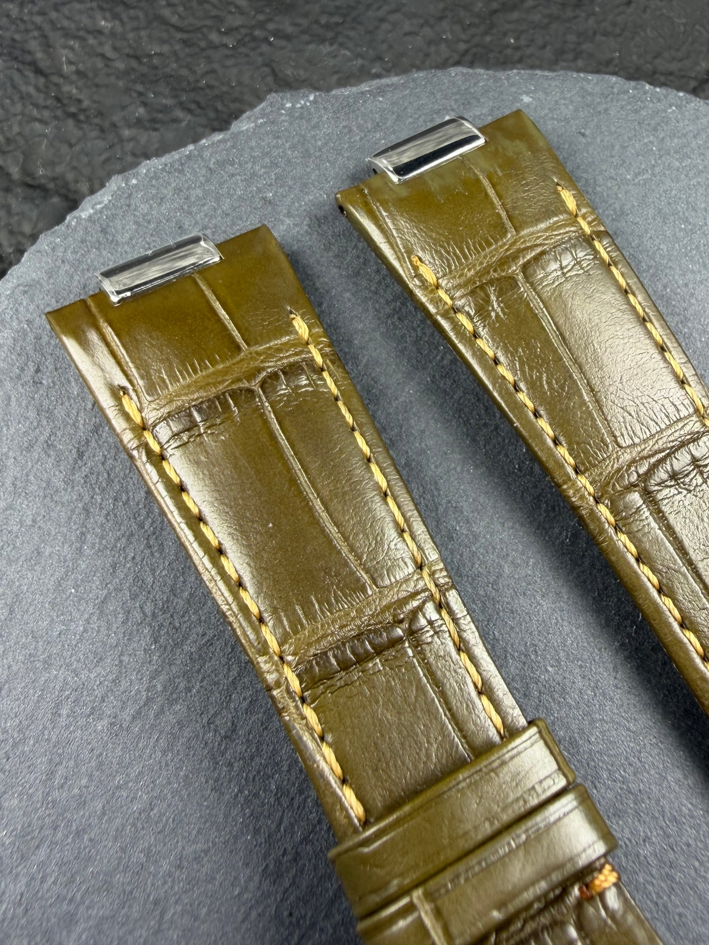 Close up of Army green alligator leather with yellow stitching for Patek Philippe nautilus watch models example 5980 , 5712 , 5711 , 5726 