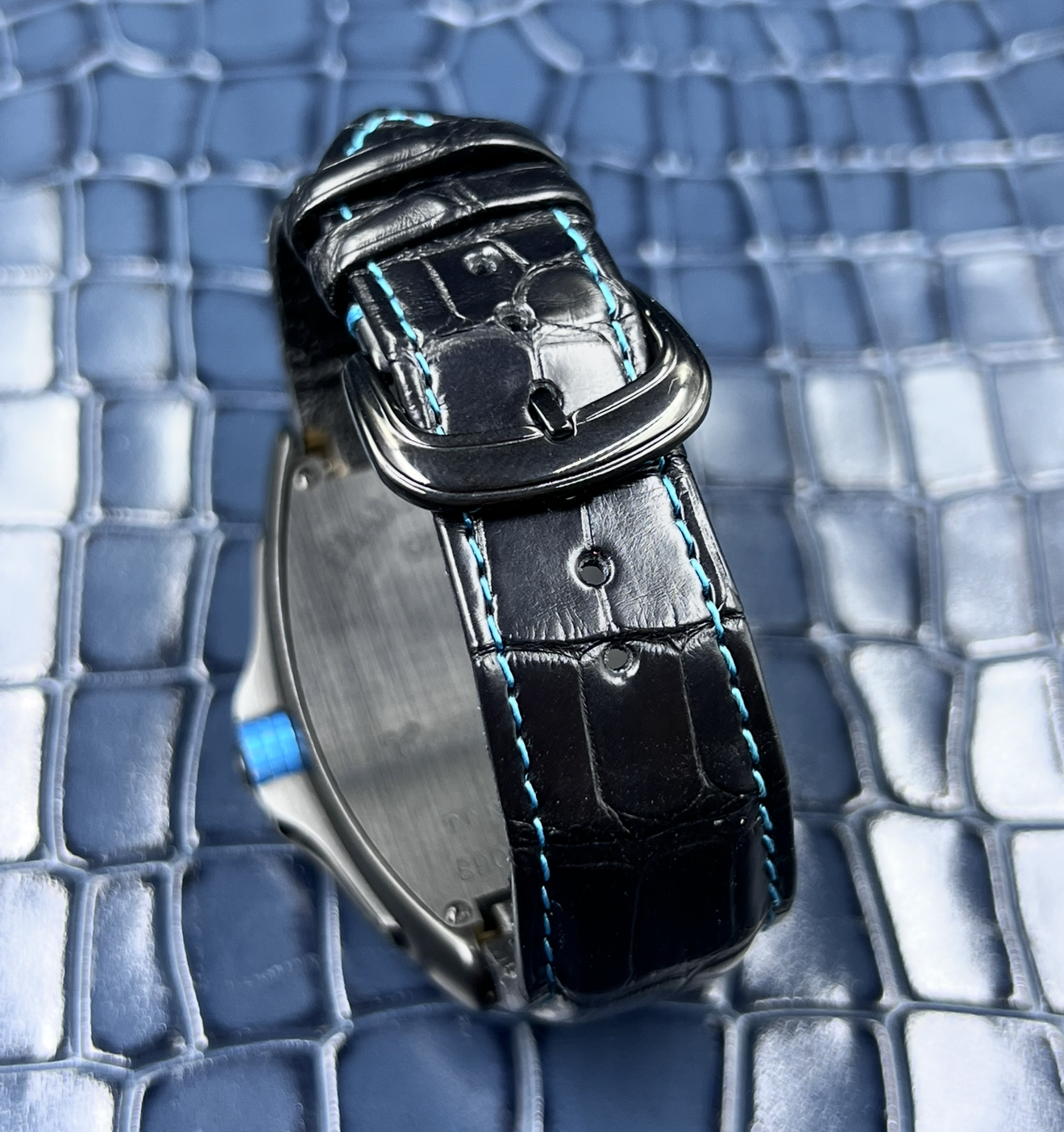 Watchstrapco black alligator strap with light blue stitching on the Franck muller 9900 conquistador model. 
