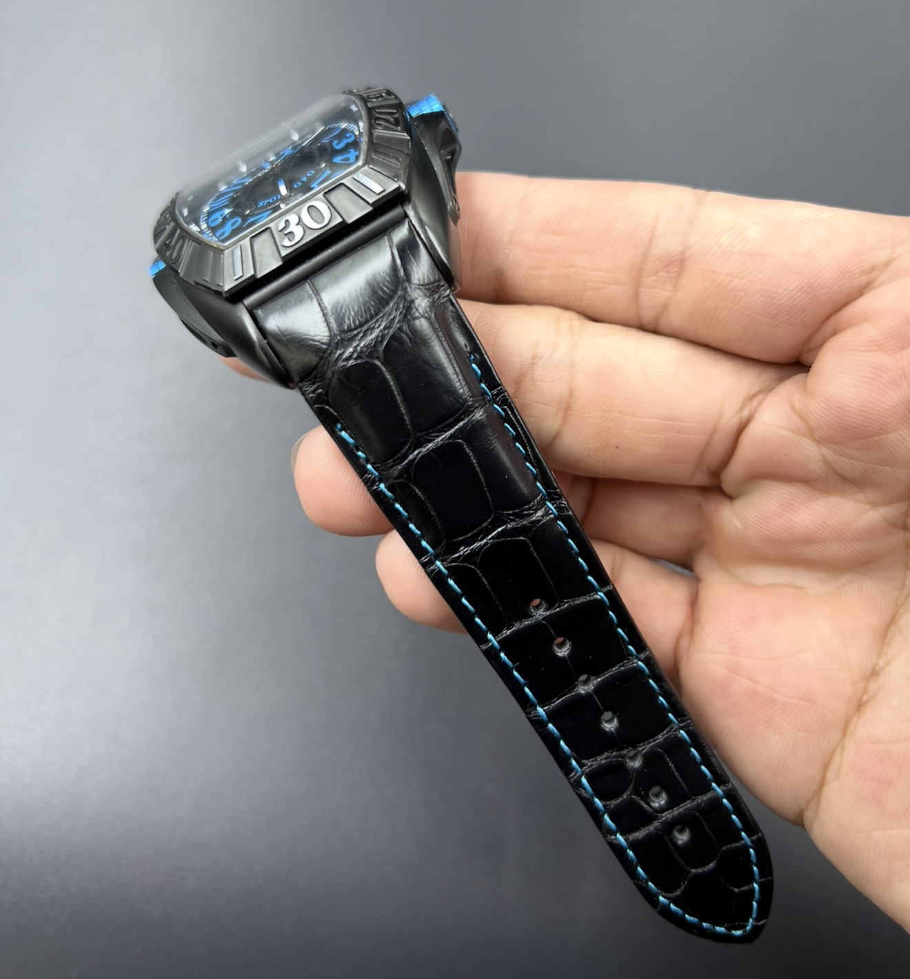 Watchstrapco black alligator strap with light blue stitching on the Franck muller 9900 watch. With matching light blue on the dial 