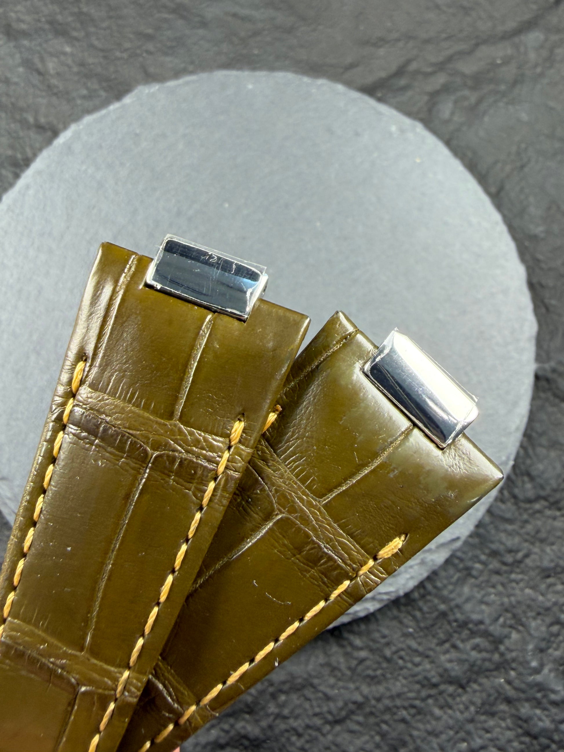 Close up of Army green alligator leather with yellow stitching for Patek Philippe nautilus watch models example 5980 , 5712 , 5711 , 5726 