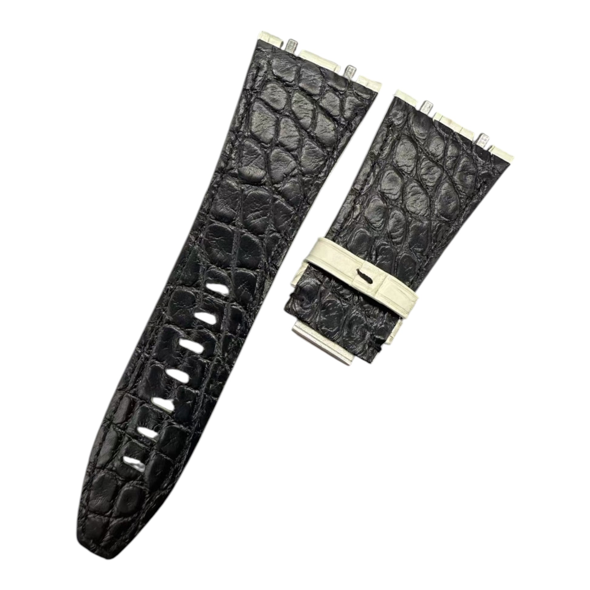 Black crocodile-patterned watch strap with beige buckle on a white background
