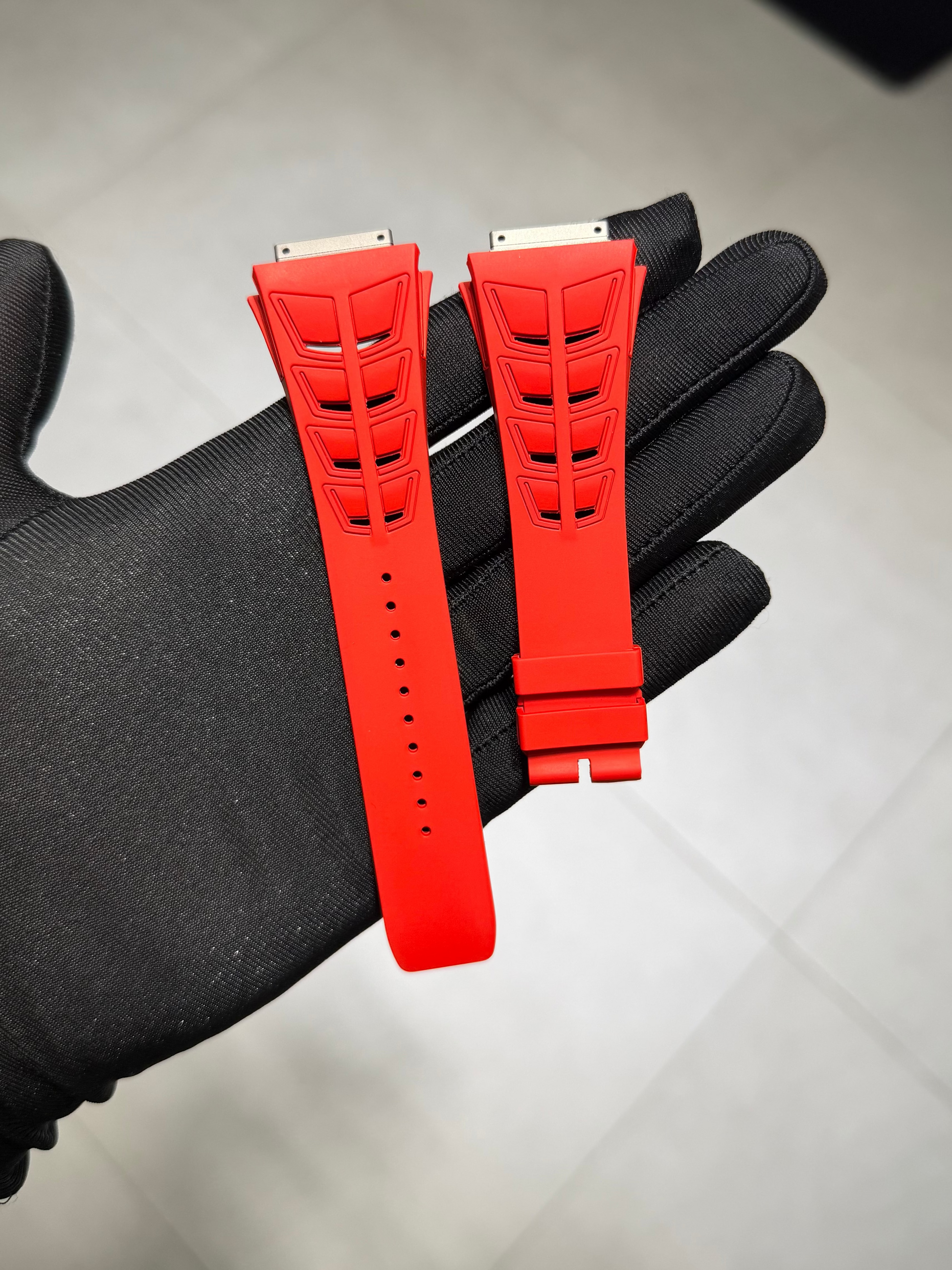 Close up of red Richard Mille 30 rubber strap 